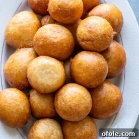 Fluffy Puff Puff pastries served on a white tray