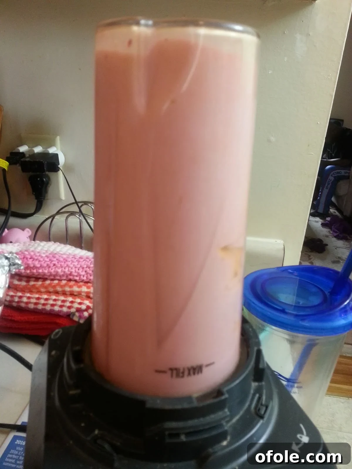 Blended yogurt and fruit mixture, smooth and ready to be poured