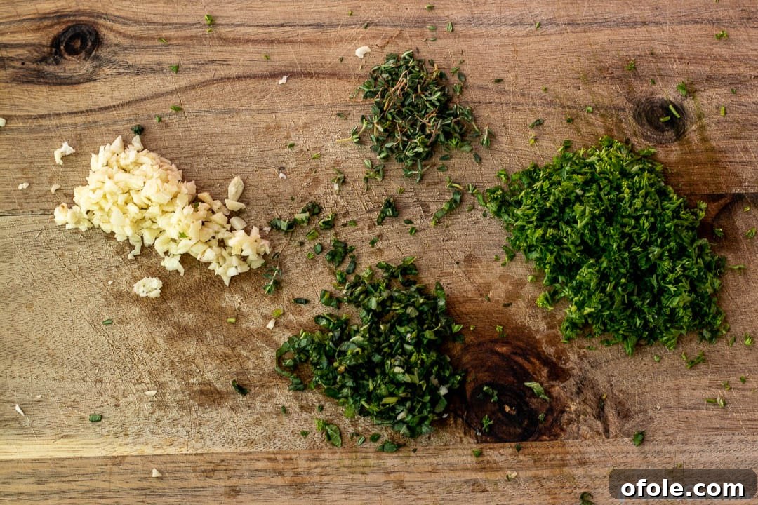 Oven-Grilled Whole Red Snapper 5 Freshly minced herbs and garlic arranged on a chopping board, ready for the marinade.