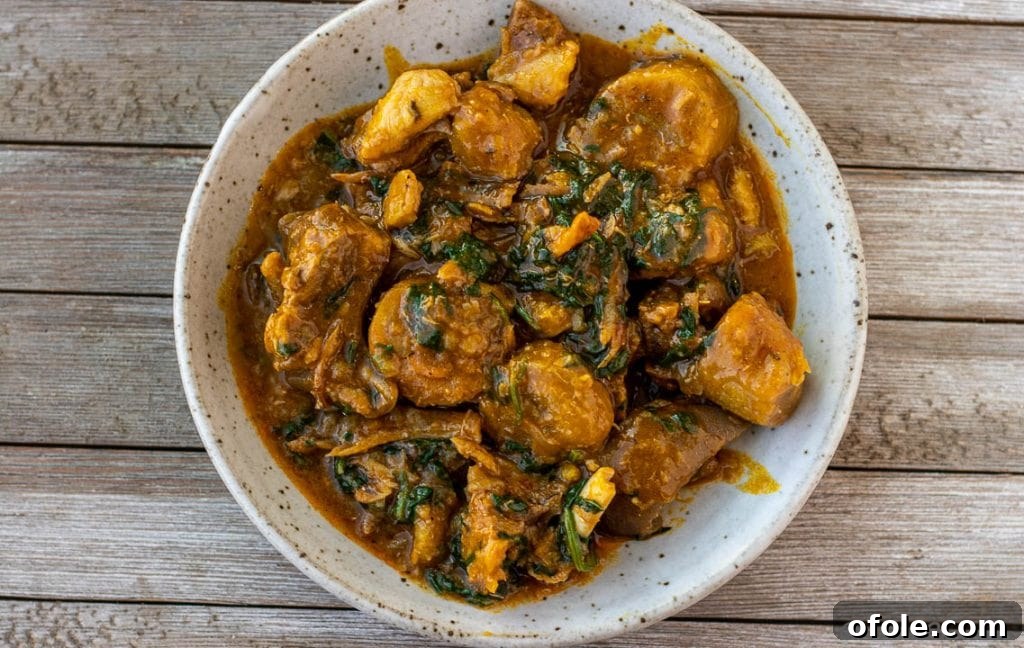 A large pot filled with delicious unripe plantain porridge, bubbling with flavor