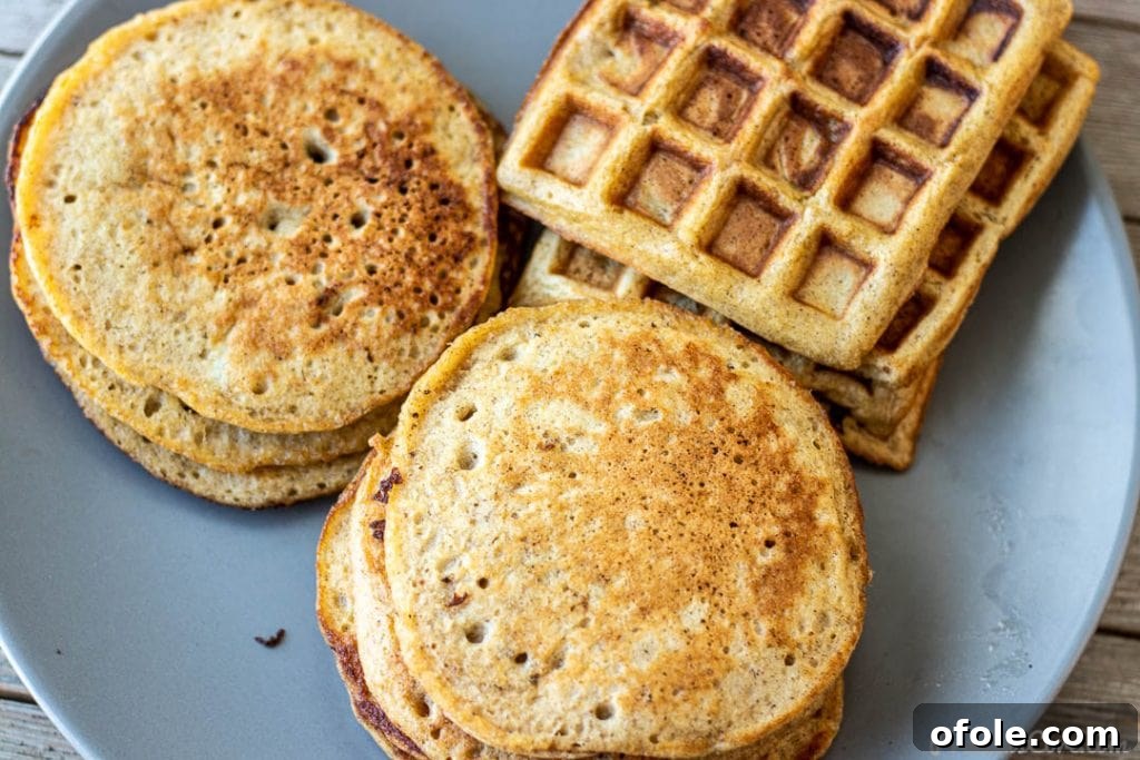 A delightful platter showcasing both fluffy plantain pancakes and perfectly golden plantain waffles.