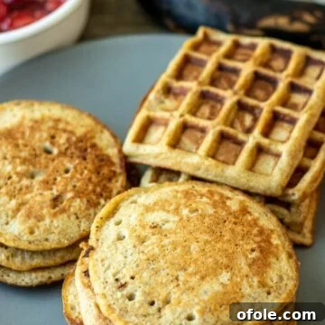 Fluffy plantain pancakes and golden plantain waffles on a serving plate, ready to be enjoyed.