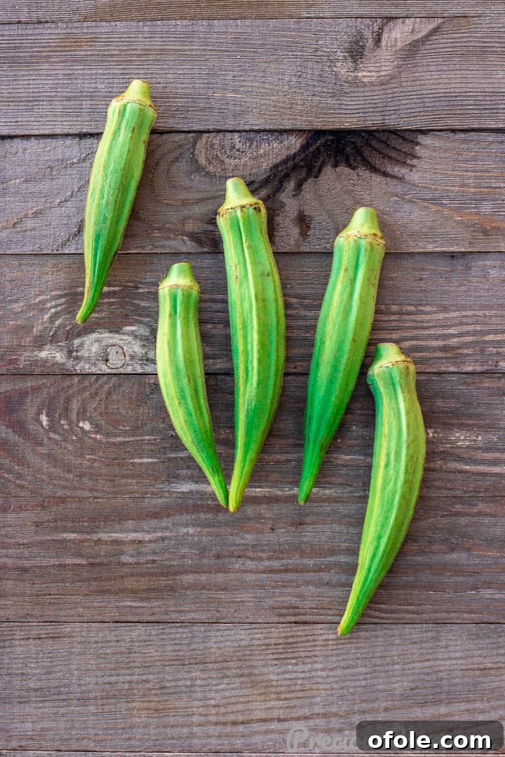 Fresh Okra on wooden board