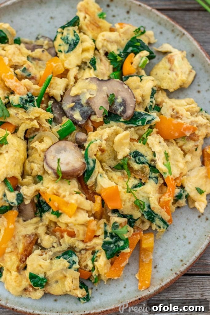 Vibrant Veggie Scramble 3 A closer shot revealing the creamy texture and colorful vegetables in the scrambled eggs.