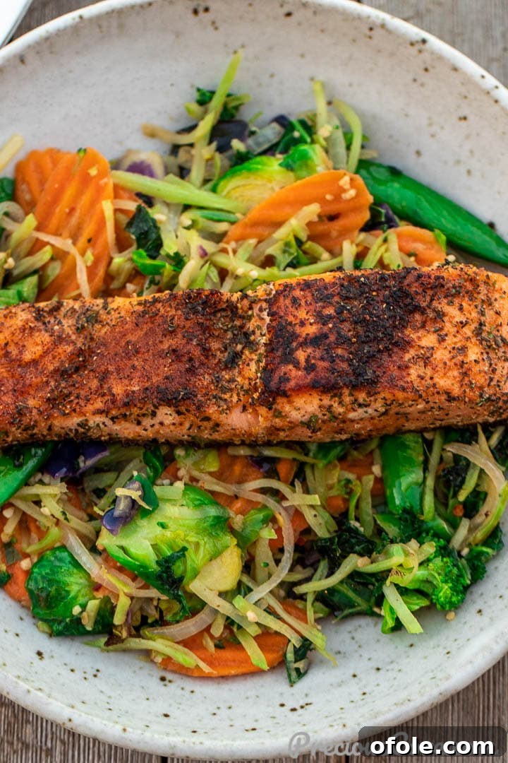 Pan-Seared Golden Salmon 3 A plate with vegetables and salmon