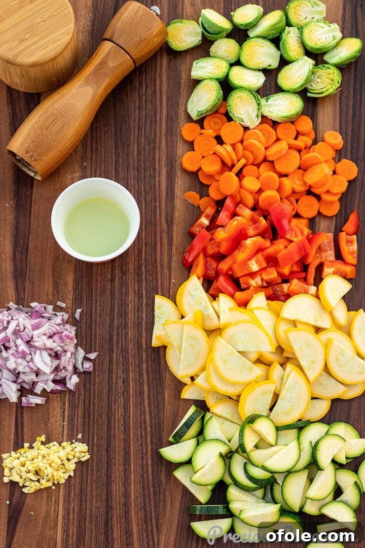 Fresh ingredients for sautéed vegetables, including sliced carrots, diced bell peppers, zucchini, yellow squash, and onions, neatly arranged on a cutting board, alongside a bottle of olive oil and spices.