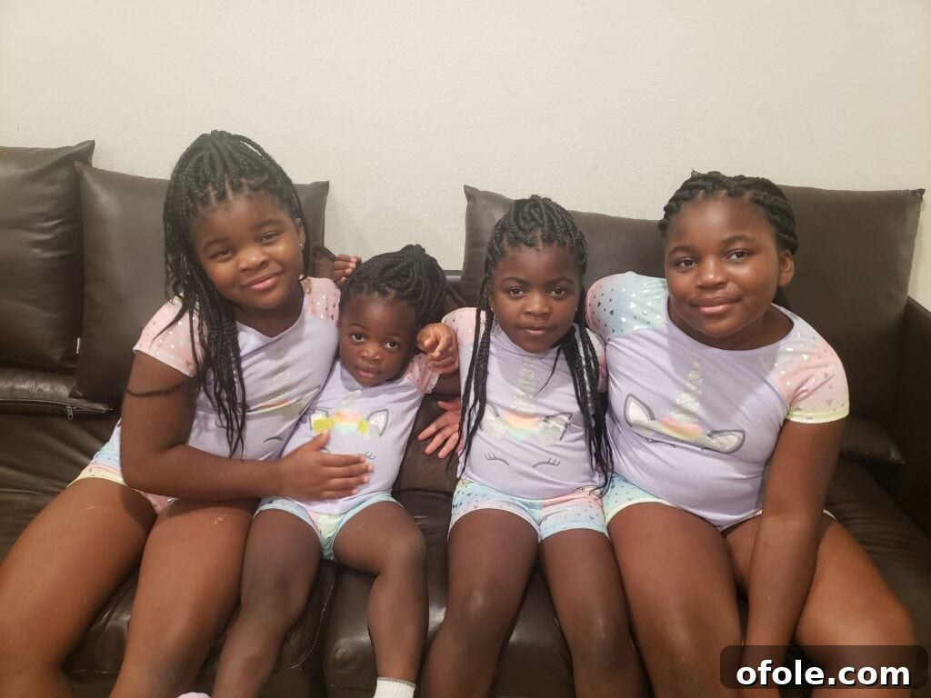 Introducing Our Little Miracle 4 Four brown girls sitting on couch, excitedly awaiting their new sister.
