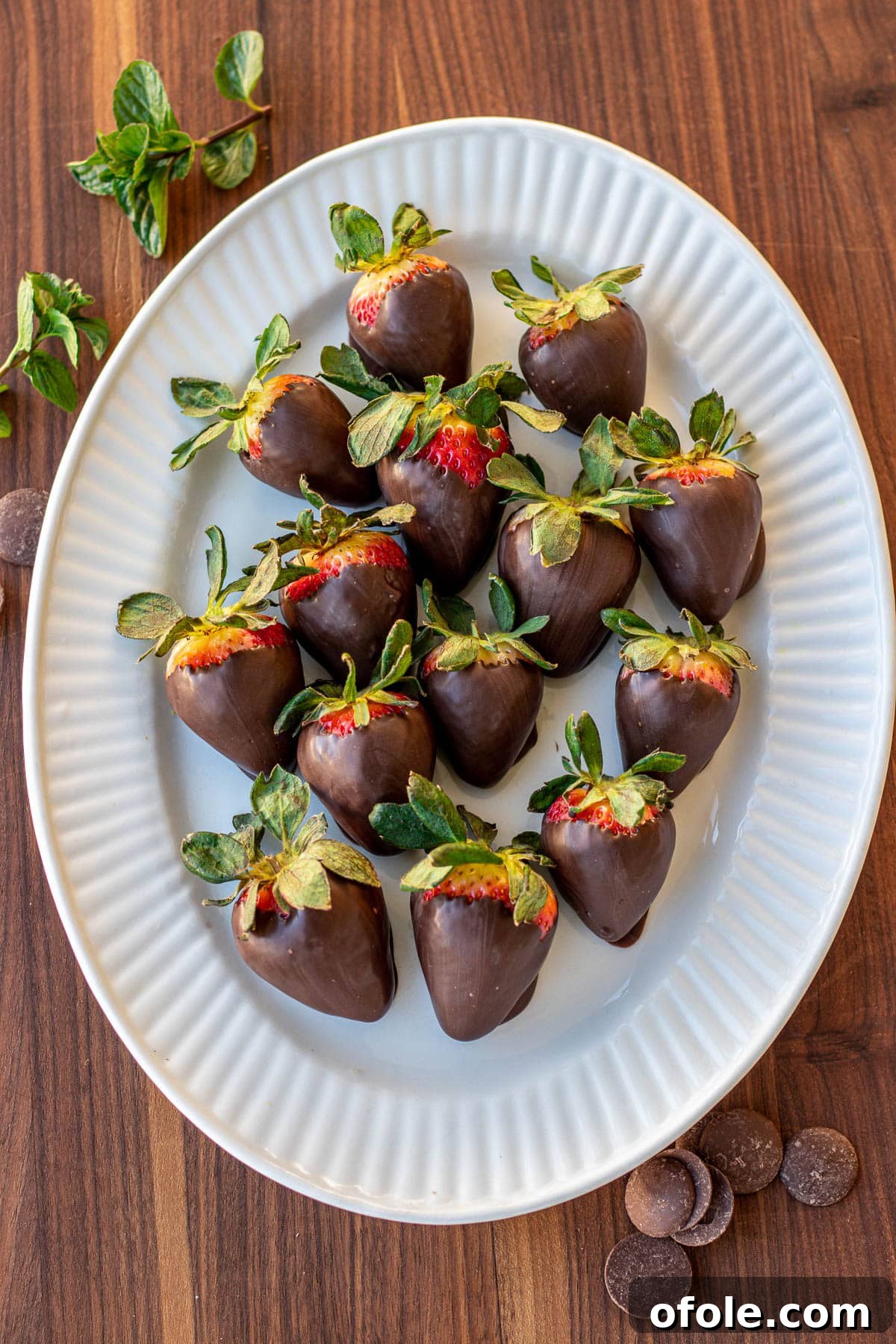 Effortless Chocolate Strawberry Indulgence 3 A vibrant platter adorned with several chocolate covered strawberries, ready for serving at a special gathering.