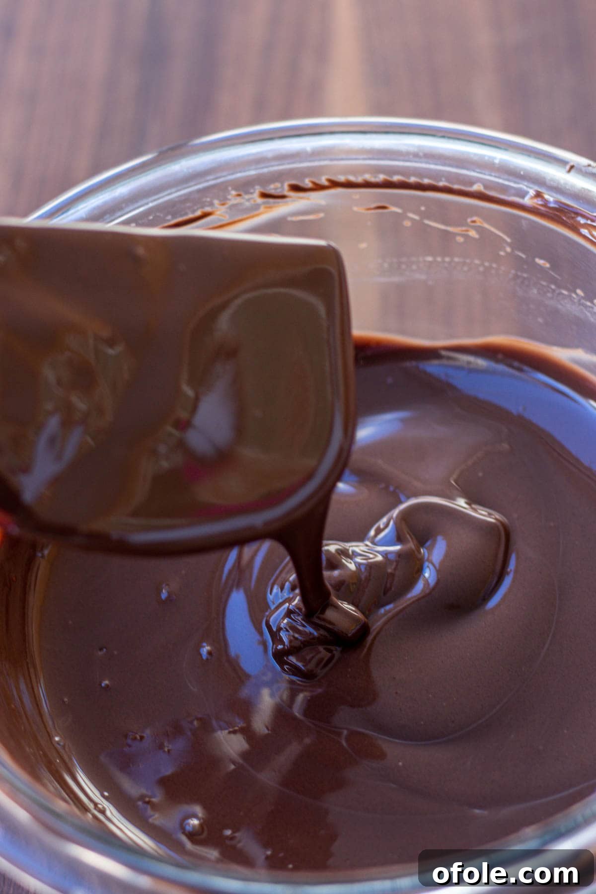 Effortless Chocolate Strawberry Indulgence 8 A close-up view of perfectly melted chocolate in a bowl, showcasing its smooth and inviting texture, ready for dipping.
