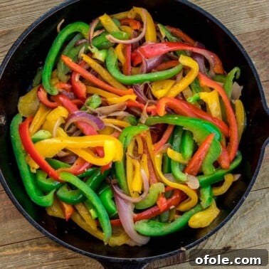Sauteed peppers and onions in a skillet
