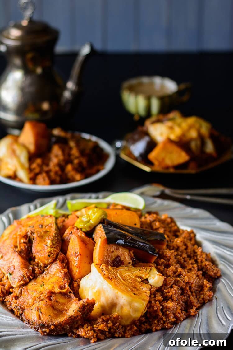 Discover Africa: 20 Irresistible Dinner Recipes 14 A serving platter of Thieboudienne, a traditional Senegalese rice and fish dish with vegetables.