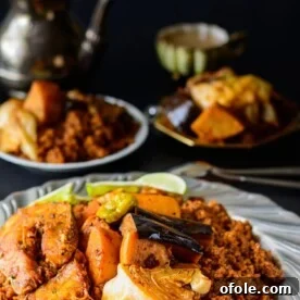 Discover Africa: 20 Irresistible Dinner Recipes 15 A captivating platter of Senegalese rice and fish, Thieboudienne, for an authentic African dinner.