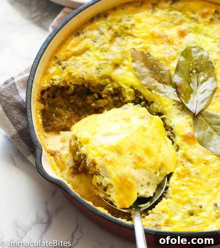 Discover Africa: 20 Irresistible Dinner Recipes 18 A cast iron pot filled with South African Bobotie, a comforting curried meat dish.