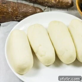 Discover Africa: 20 Irresistible Dinner Recipes 38 Water fufu or cassava fufu on a white plate, ready to be served.