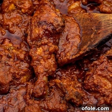 Discover Africa: 20 Irresistible Dinner Recipes 39 Red tomato chicken stew, a classic African dinner recipe.
