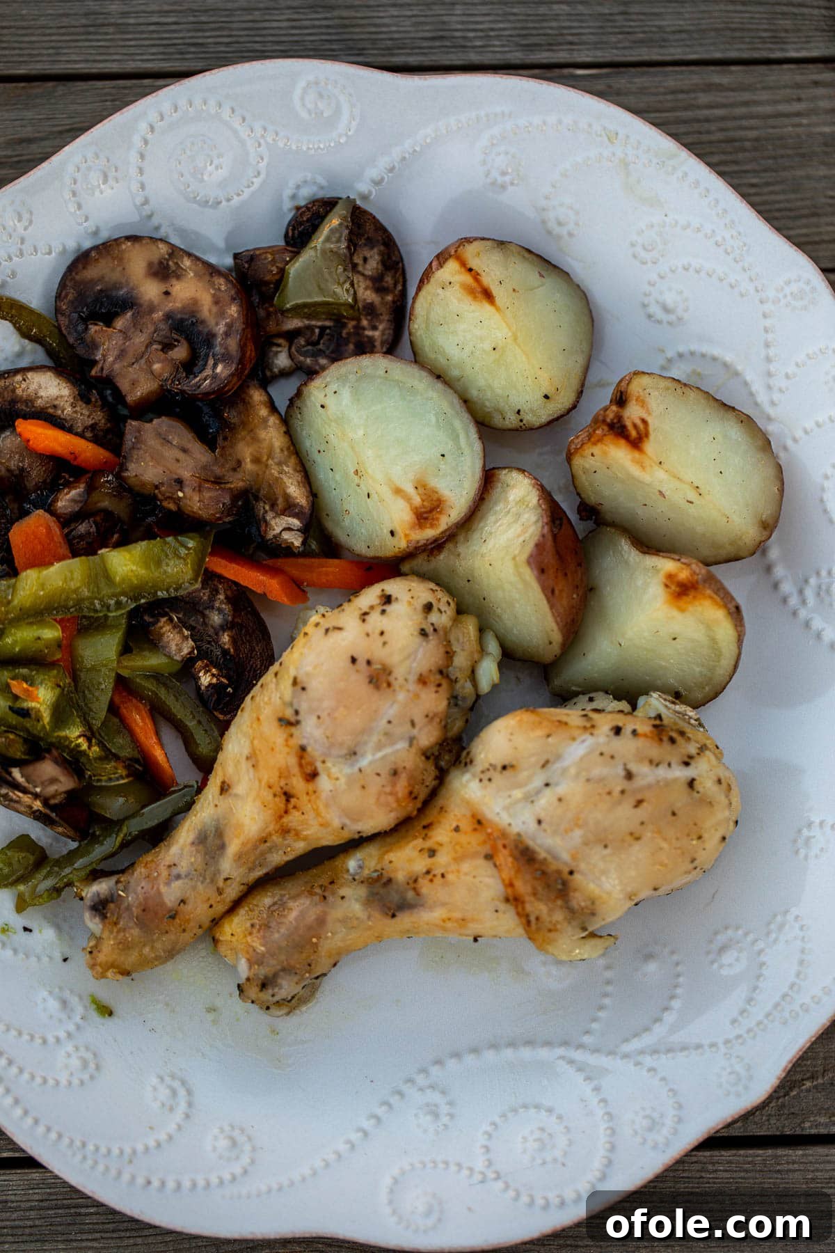 One-Pan Roasted Chicken, Potatoes, and Vegetables 3 A vibrant and appealing plate showcasing roasted chicken, tender potatoes, and colorful vegetables, beautifully plated for a hearty meal.