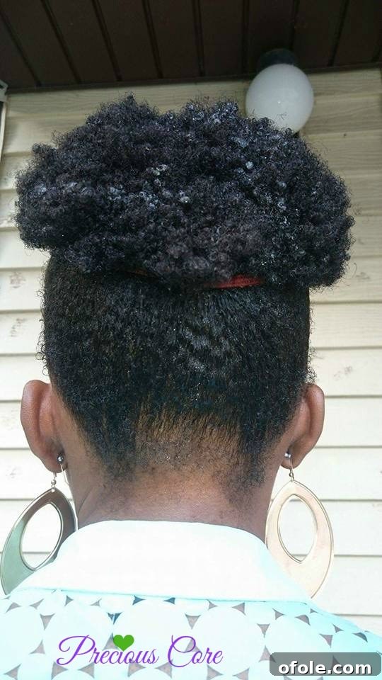 Healthy natural hair after wash Close-up of moisturized natural hair texture