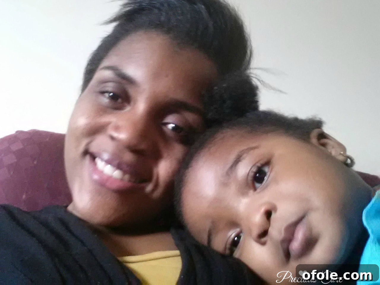 First natural hair haircut Woman with short, transitioning natural hair