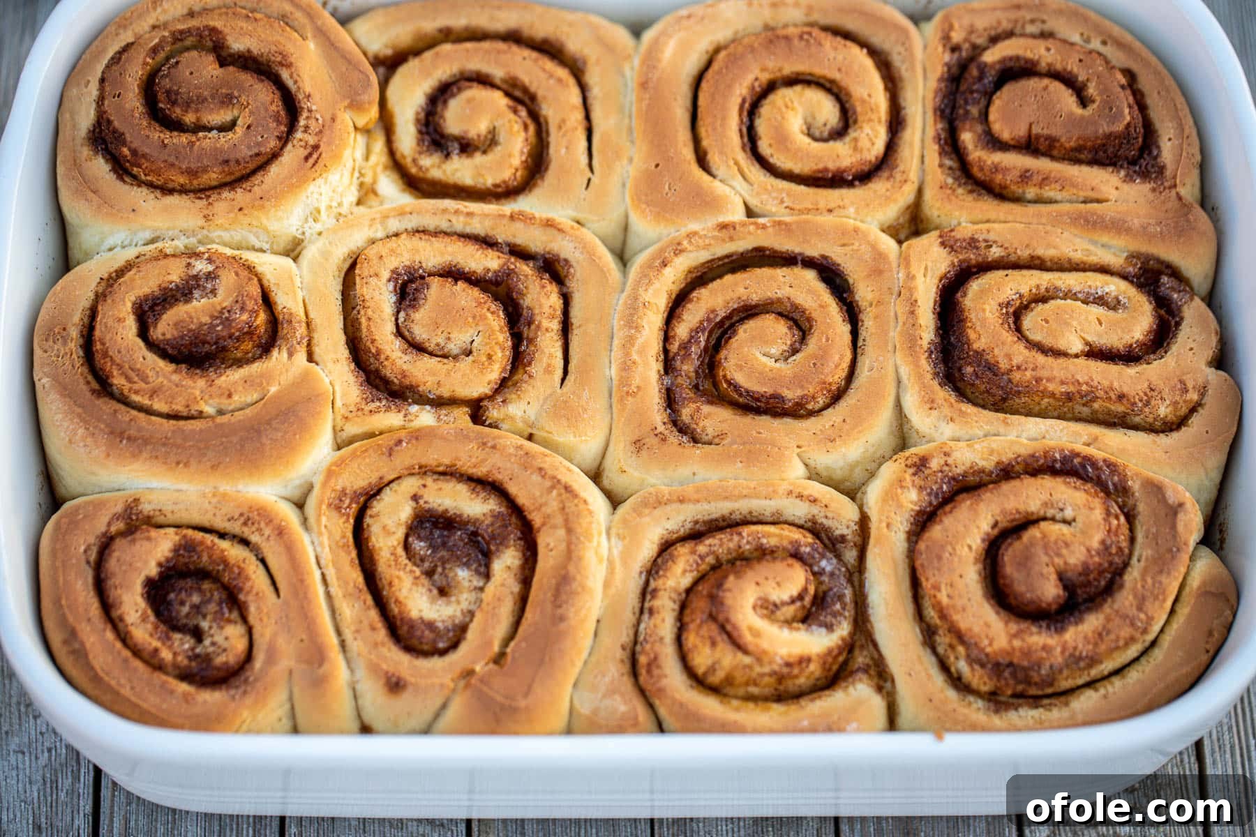 Heavenly Cinnamon Swirls with Tangy Cream Cheese Glaze 16 Landscape picture of baked cinnamon rolls