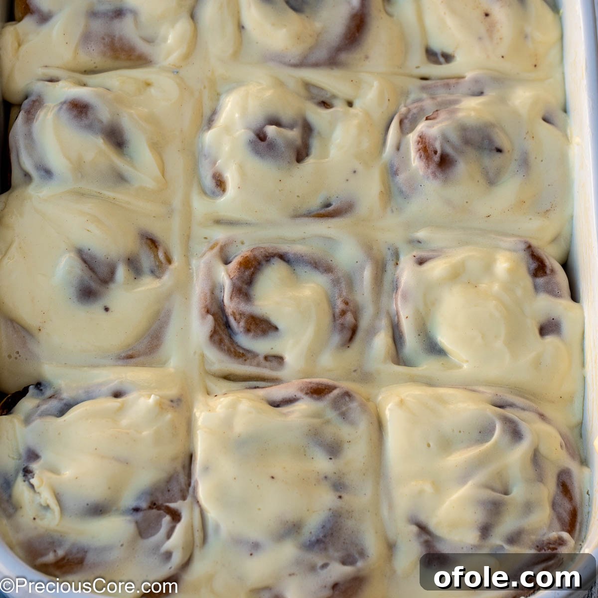 Heavenly Cinnamon Swirls with Tangy Cream Cheese Glaze 17 Square image of cinnamon rolls with cream cheese frosting.
