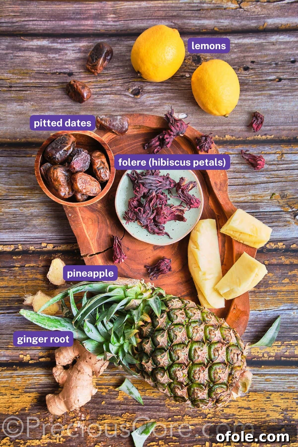 Cameroonian Folere Hibiscus Refresher 4 A curated selection of fresh ingredients, including dried hibiscus petals, pineapple, ginger, and dates, meticulously arranged for making Folere Drink.