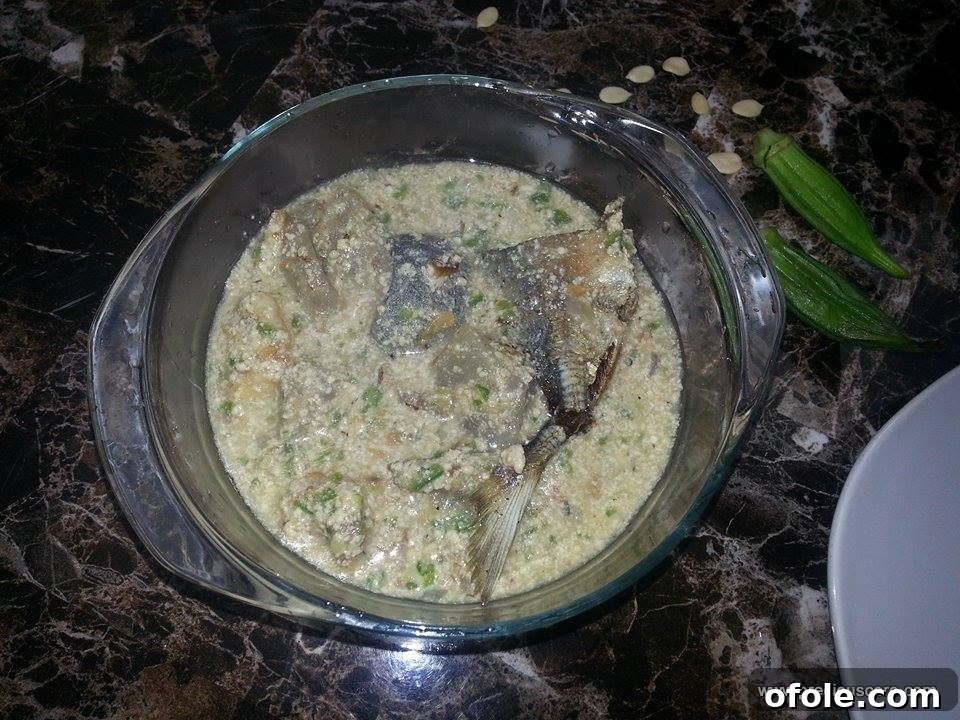 Unlock the Secrets of Delicious Okra Egusi Soup 2 Close-up of a steaming bowl of Okra-Egusi Soup paired with a swallow