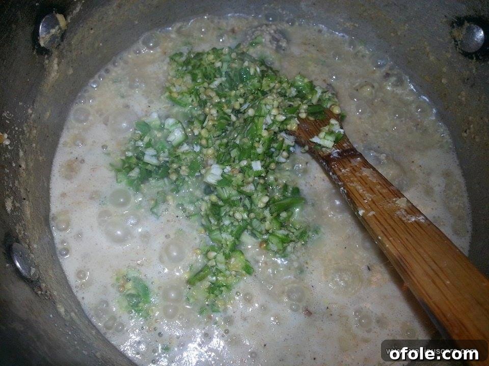Unlock the Secrets of Delicious Okra Egusi Soup 7 Freshly chopped okra added to the simmering egusi soup