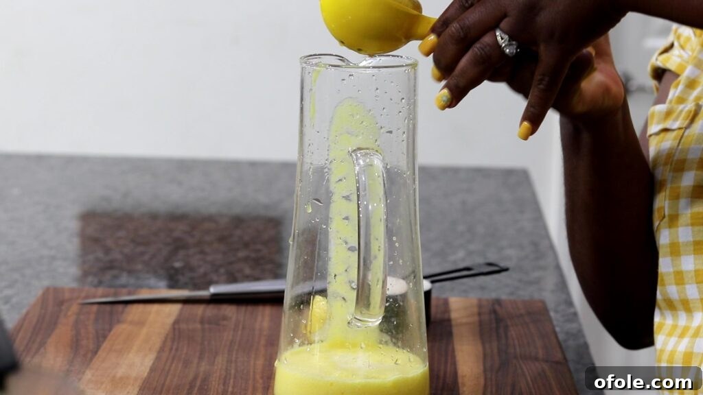 Tropical Zest Quench 6 Squeezing lemon juice into a pitcher
