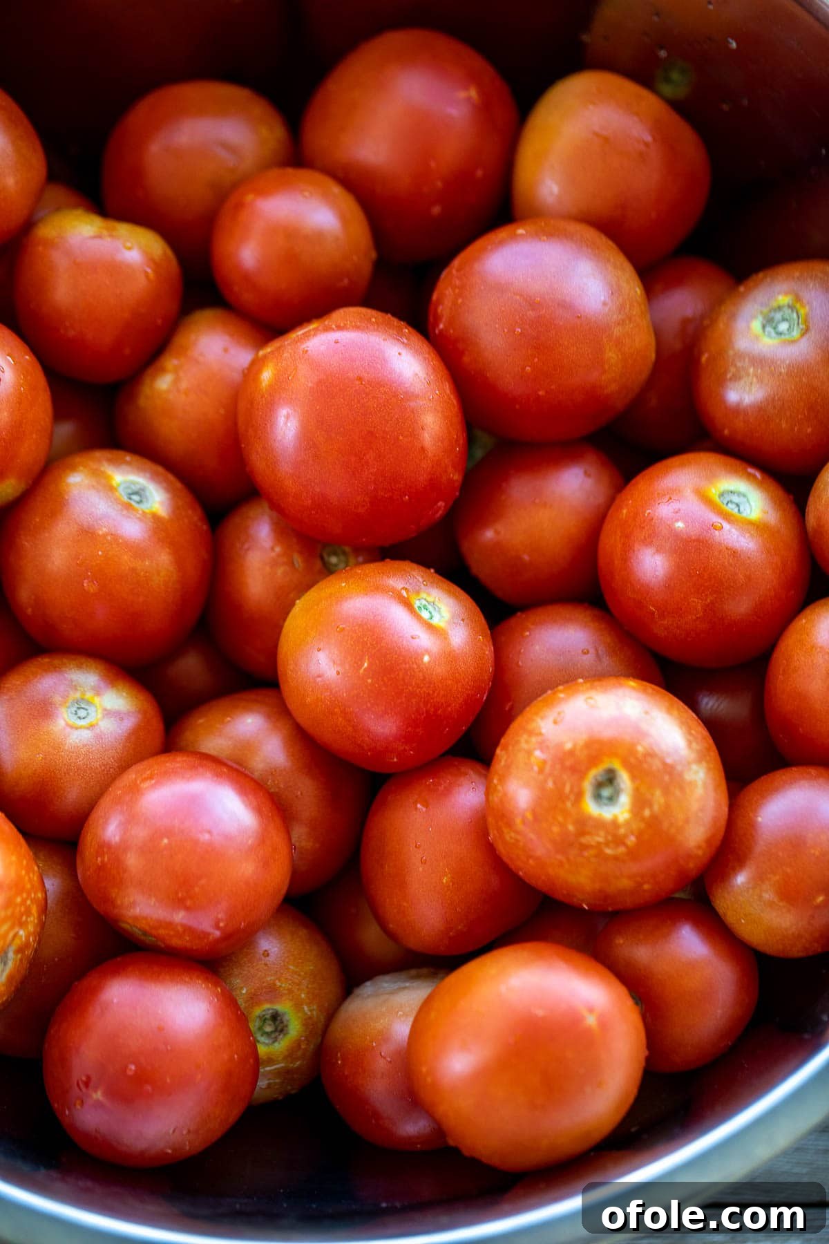 Slow-Simmered Homemade Tomato Paste 4 A generous pile of fresh, ripe tomatoes, perfect for making paste.
