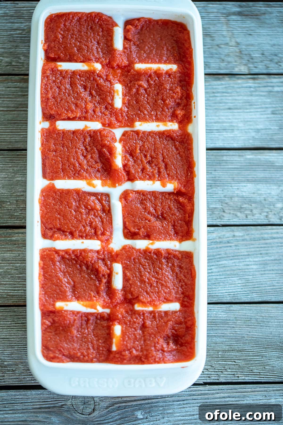 Slow-Simmered Homemade Tomato Paste 9 Homemade Tomato Paste portioned and frozen in an ice cube tray.