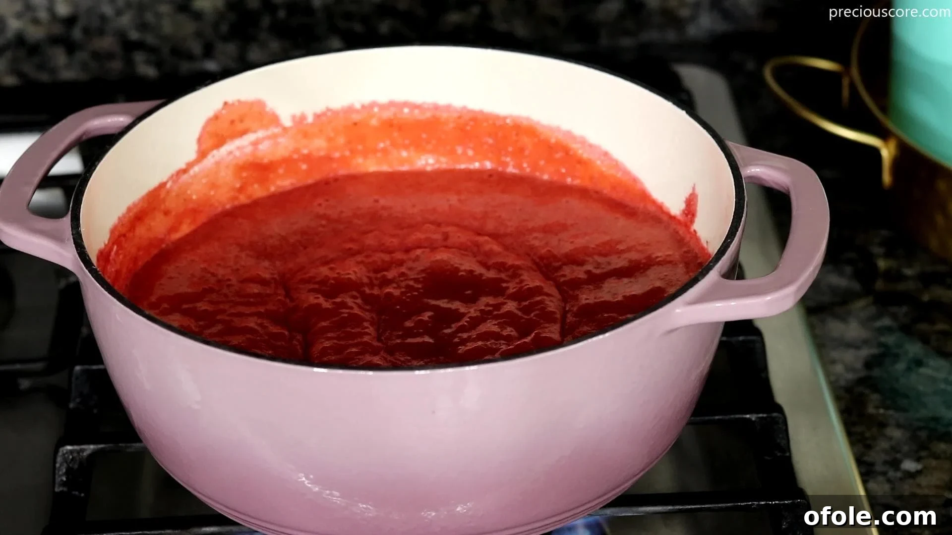 Easy No Churn Strawberry Ice Cream 5 Pot with strawberry reduction simmering on the stove