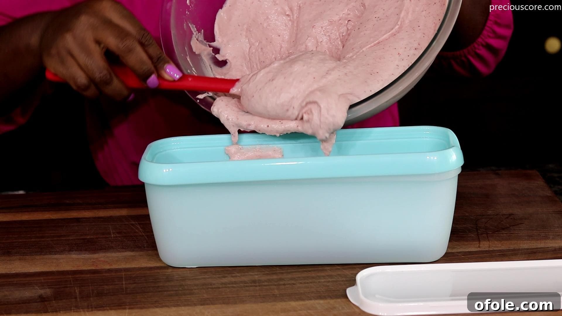 Easy No Churn Strawberry Ice Cream 8 Strawberry ice cream mixture being poured into a loaf pan for freezing
