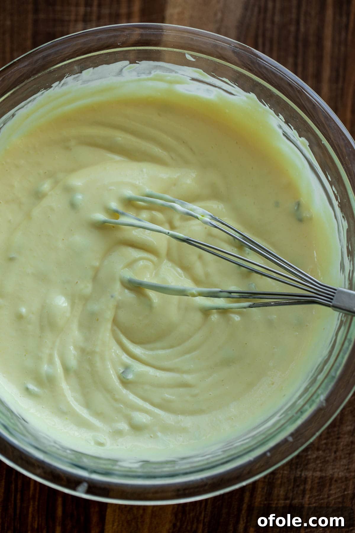 Creamy Chicken Pasta Delight 6 Creamy dressing being whisked in a separate bowl.