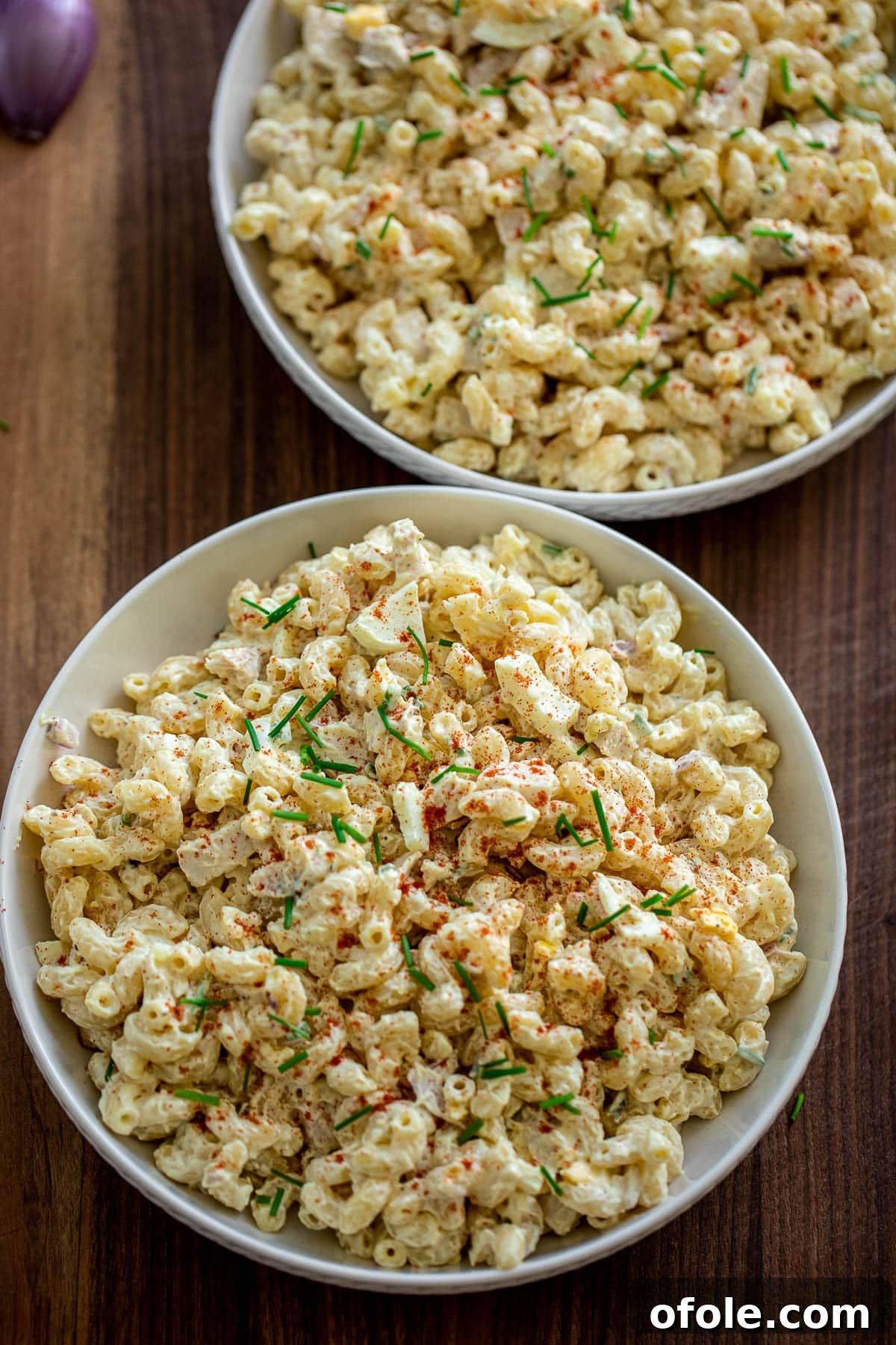 Creamy Chicken Pasta Delight 9 Two large bowls filled with creamy chicken macaroni salad.