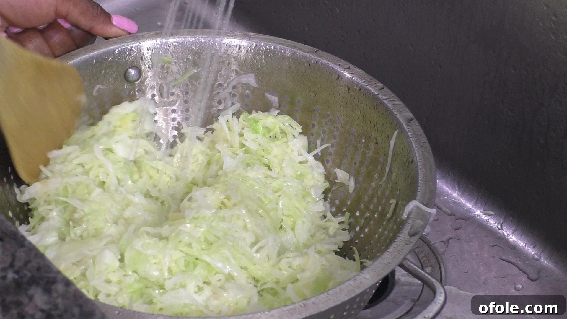 Rustic Beef and Cabbage Stew 6 Freshly blanched cabbage being rinsed with cold water in a colander