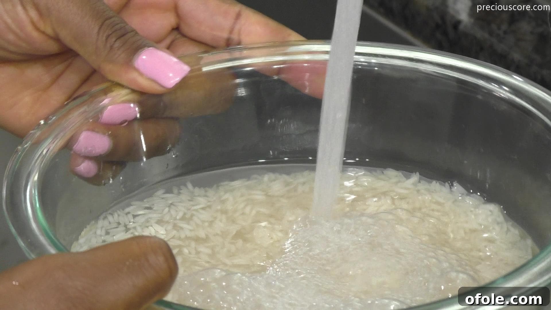 East Africa's Sweet Secret: Vitumbua Coconut Rice Pancakes 4 Water being poured over rice in a bowl, beginning the soaking process for Vitumbua.