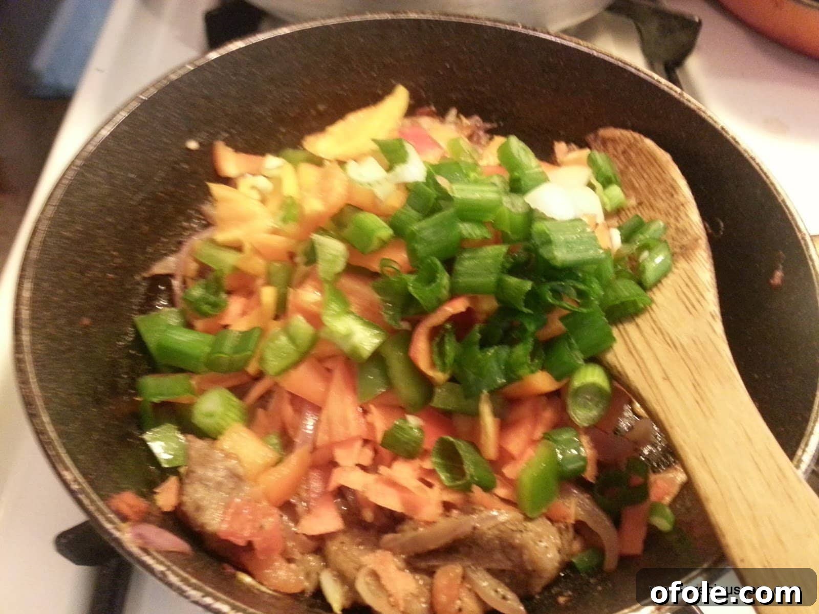 Plantain Boats: Unlock Your Creativity with Tropical Flavors 10 Garlic, shredded meat, and mixed vegetables added to the pan with the tomato mixture