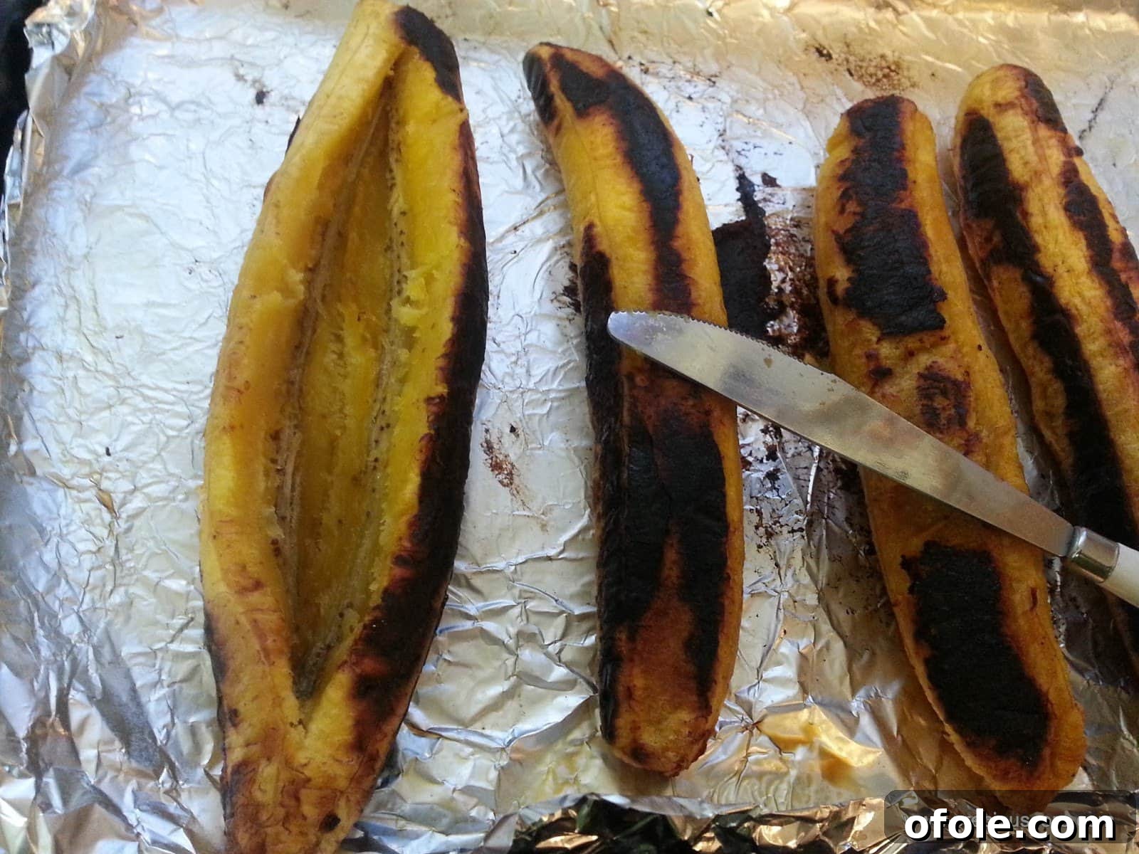 Plantain Boats: Unlock Your Creativity with Tropical Flavors 12 Roasted plantain with a lengthwise slit opened up to form a boat