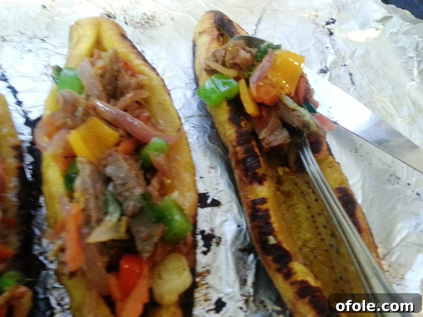 Plantain Boats: Unlock Your Creativity with Tropical Flavors 14 Plantain boat being generously stuffed with the savory filling