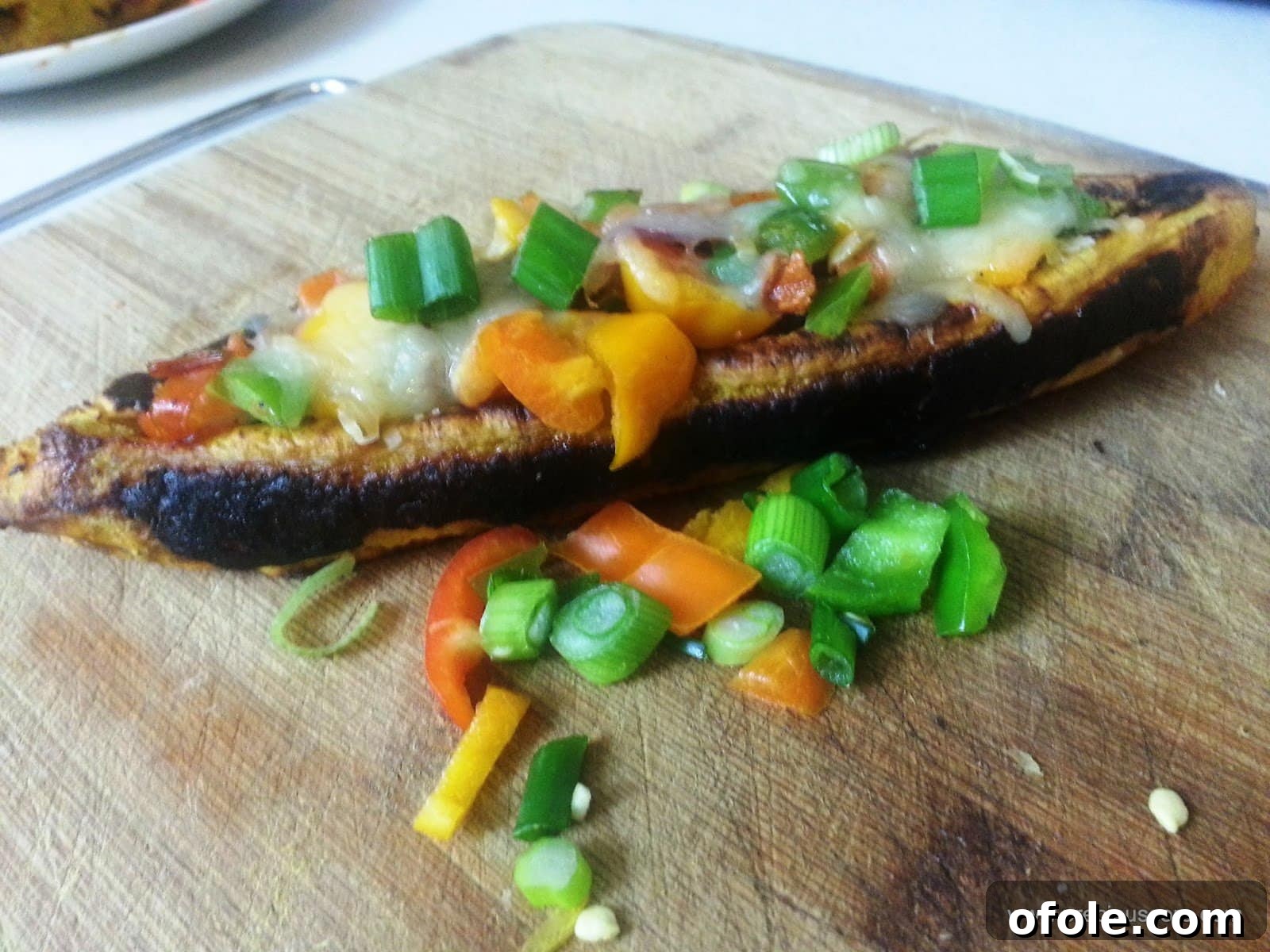 Delicious plantain boats freshly baked, stuffed with savory filling and melted cheese
