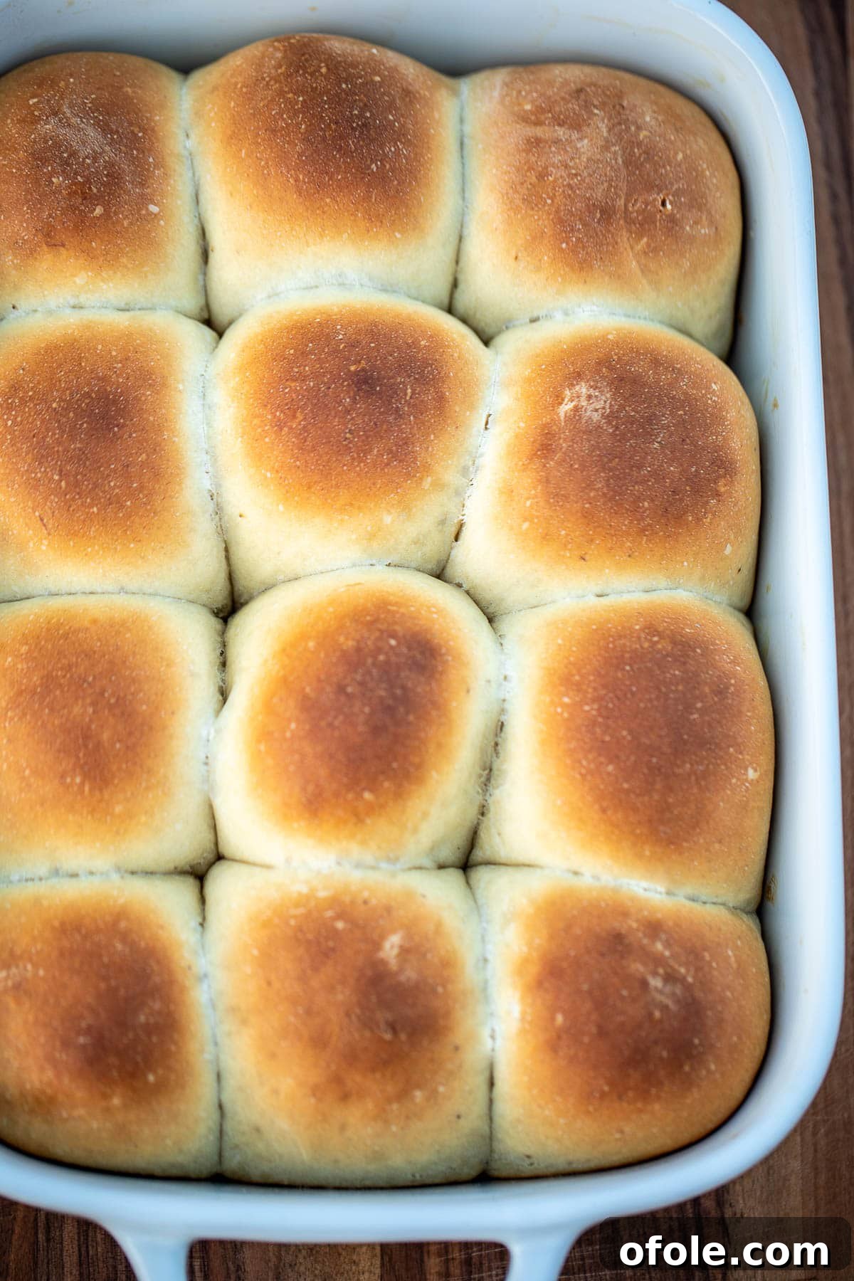 Golden Banana Bread Rolls 7 Freshly baked banana bread rolls, golden brown and perfectly puffed, still in the baking pan.