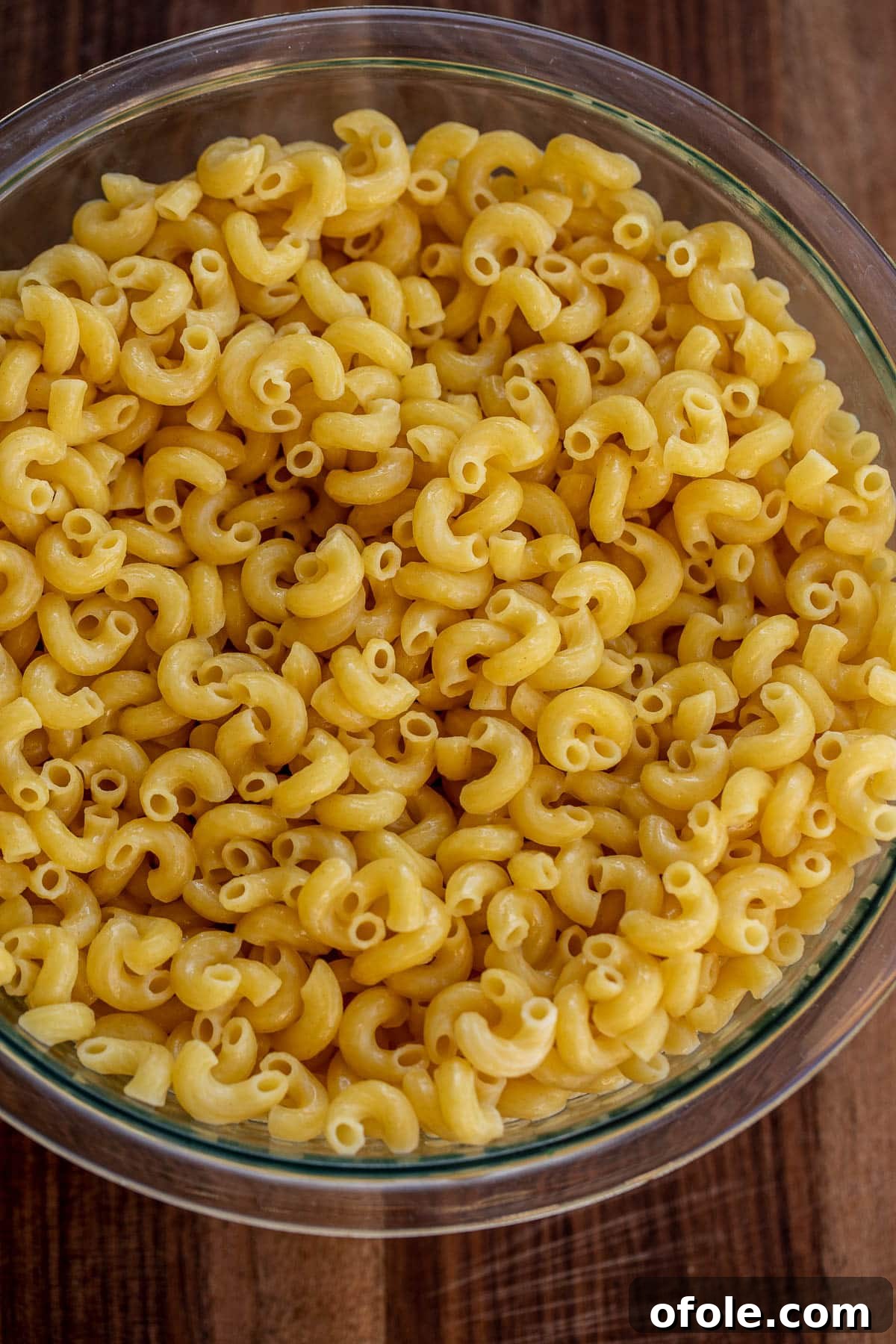 Ultimate Three-Cheese Mac and Cheese 4 Bowl of cooked macaroni tossed with butter to prevent sticking