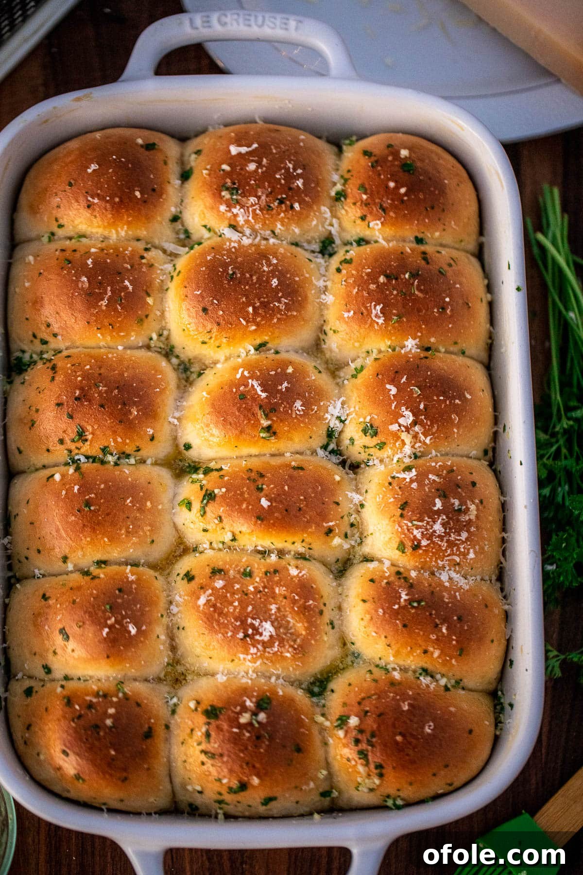 Buttery Garlic Dinner Rolls 14 Close-up of garlic butter rolls topped with freshly grated Parmesan cheese, highlighting their appetizing texture.