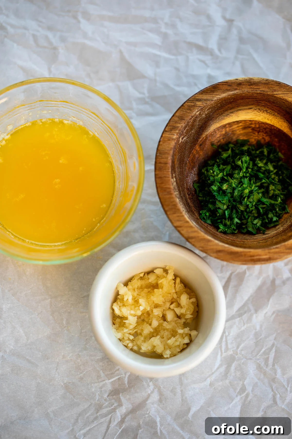 Buttery Garlic Dinner Rolls 5 Fresh garlic cloves, melted butter, and chopped parsley, the core ingredients for the aromatic garlic butter.