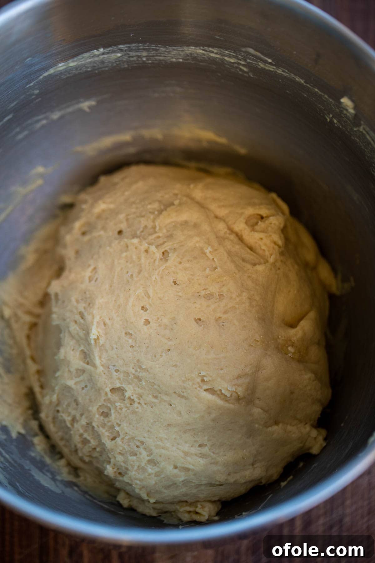 Buttery Garlic Dinner Rolls 6 Dough forming in a stand mixer, demonstrating the initial mixing step for the rolls.
