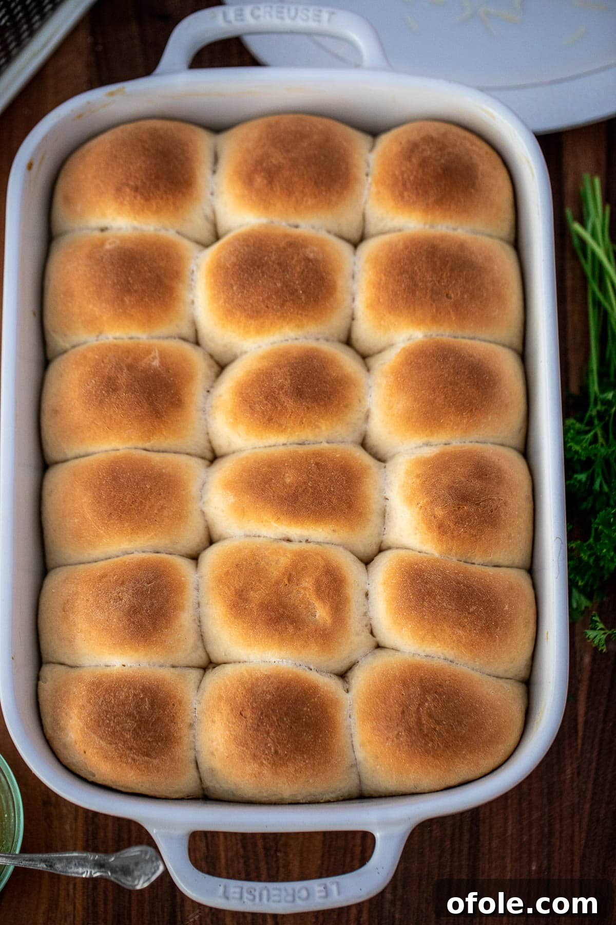 Buttery Garlic Dinner Rolls 10 Freshly baked, golden-brown dinner rolls in a baking dish, straight out of the oven.