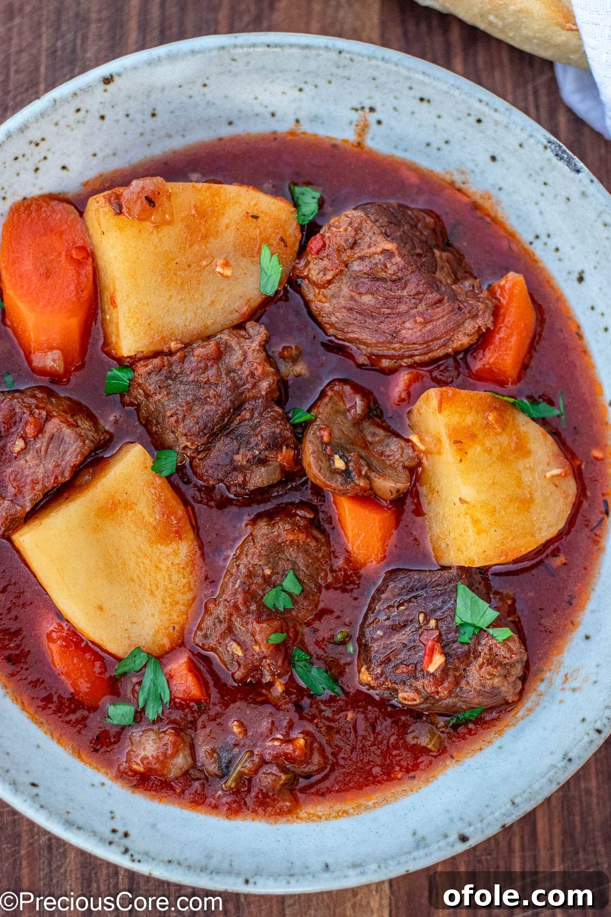 Wine-Free Beef Stew 2 Beef Stew Without Wine in a rustic bowl, garnished with fresh parsley.