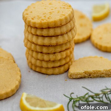 A stack of golden Lemon Shortbread Cookies, perfectly baked and ready.