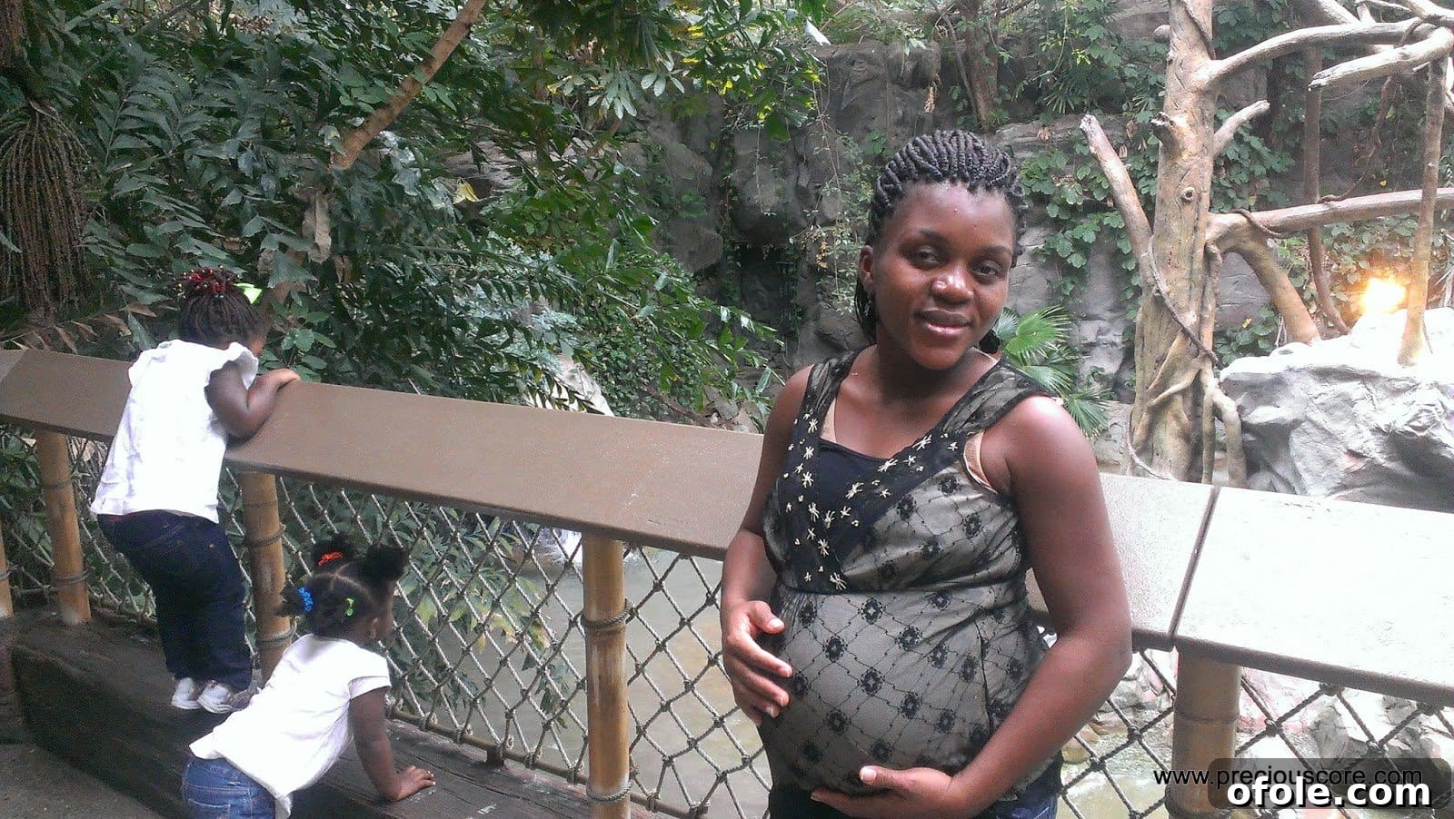 Pregnant woman looking tired but hopeful.