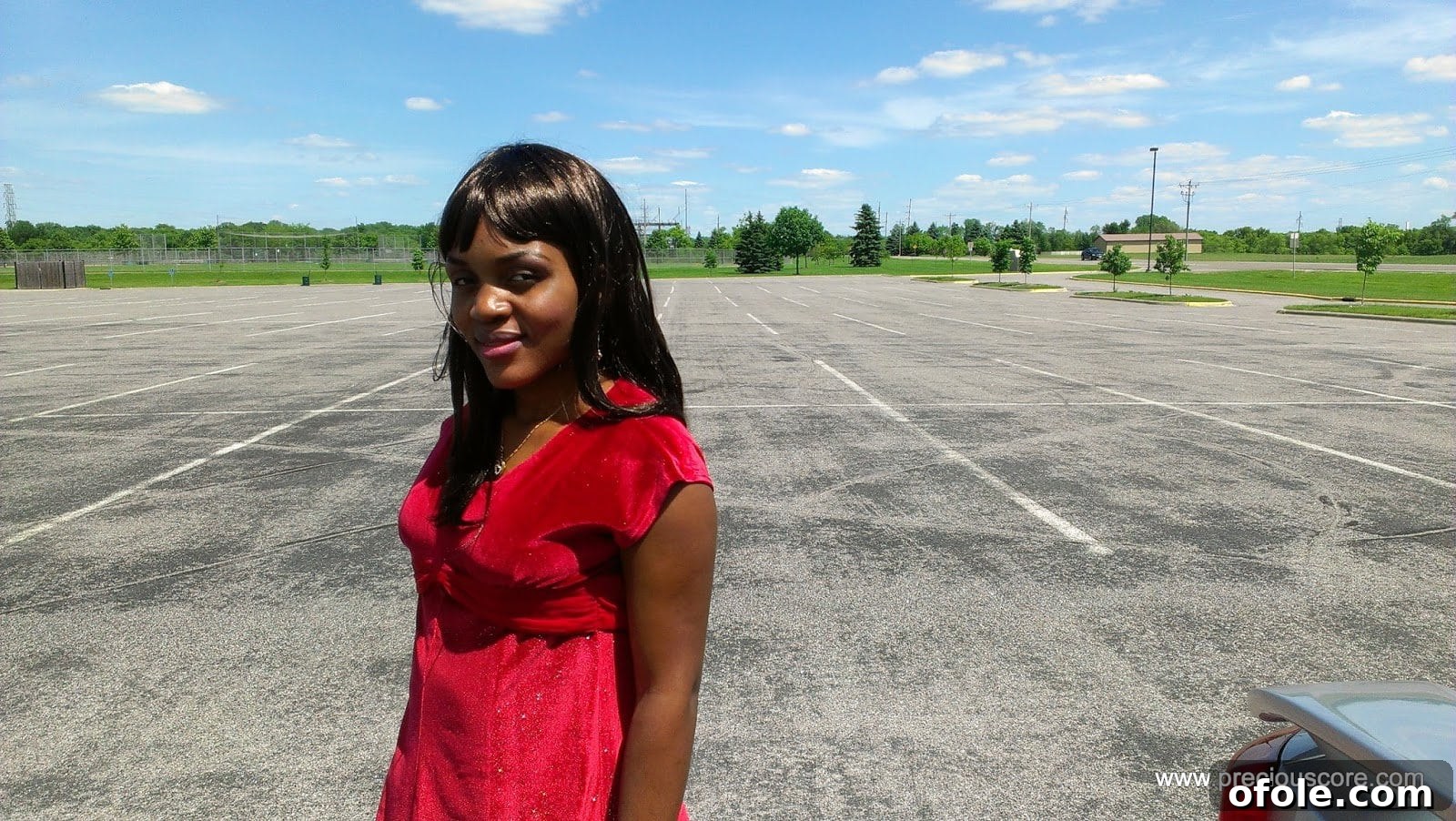 A pregnant woman, showing her growing baby bump.